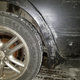 The area in front of the rear wheel, it is pushed inward and the paint took a real beating, the door latches and is still water tight.